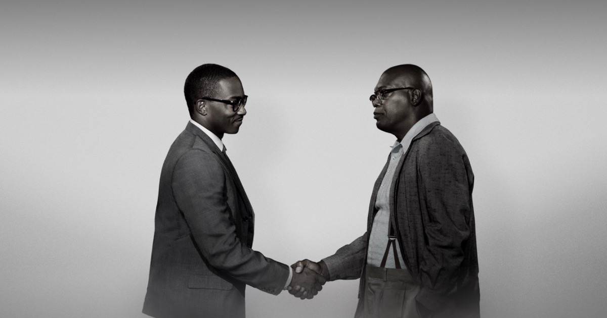 Image of Samuel L. Jackson and Anthony Mackie Shaking hands in The Banker.