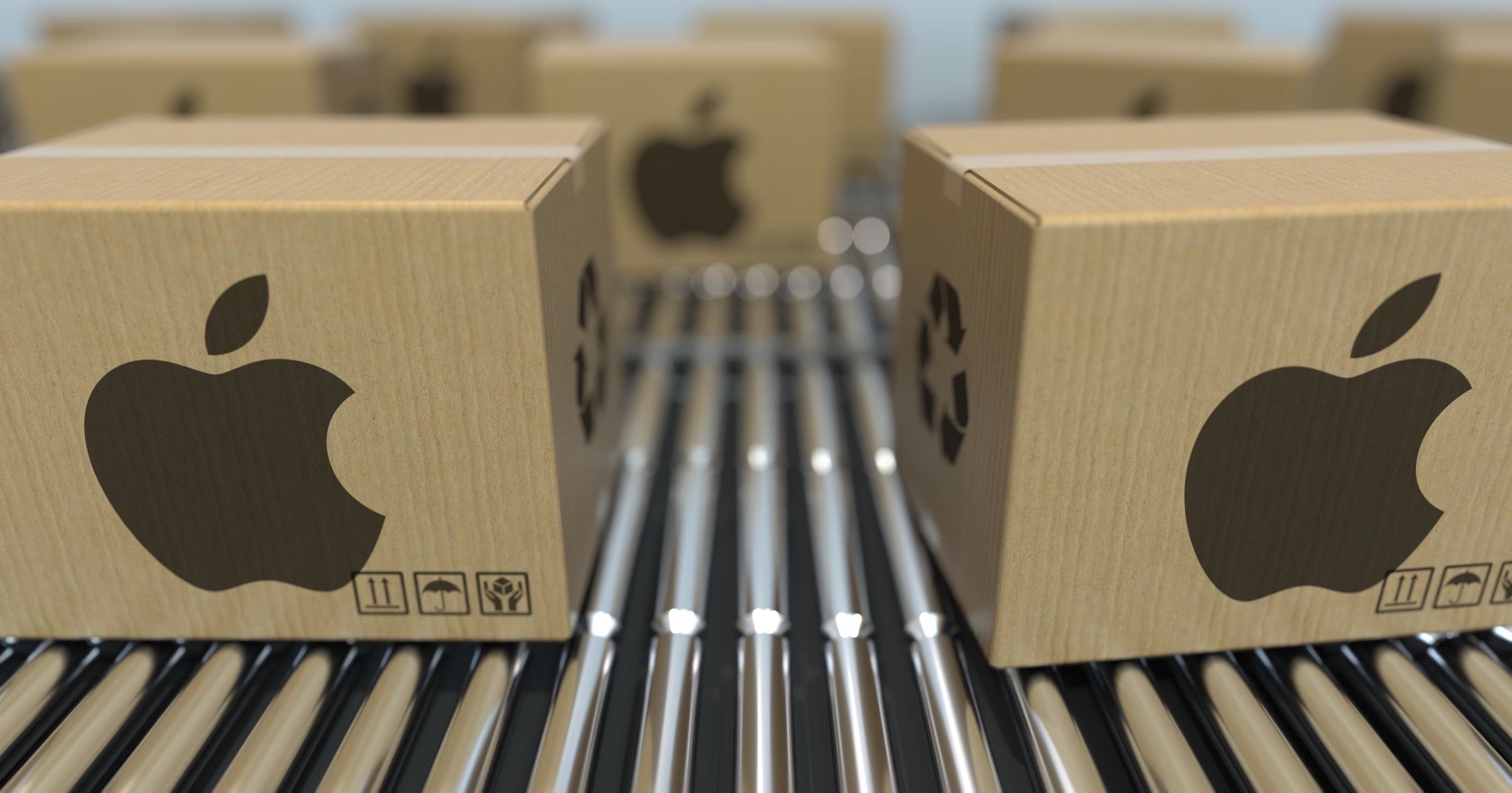 Apple cardboard boxes on assembly line.